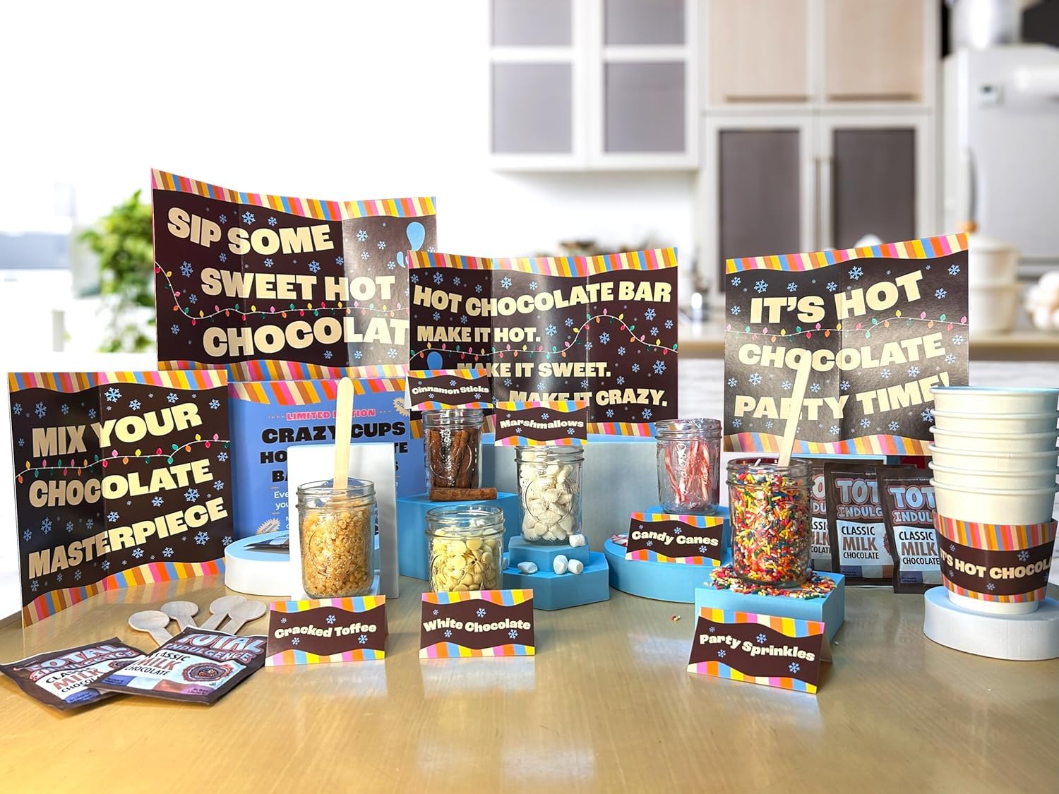 Crazy Cups Deluxe Hot Cocoa Bar Supplies Kit, Includes Hot Cocoa Bar Signs, Marshmallows, Candy Canes, Cinnamon Sticks, Sprinkles, Hot Cups With Sleeves, Hot Chocolate, Table Tents, Spoons, 6 Servings