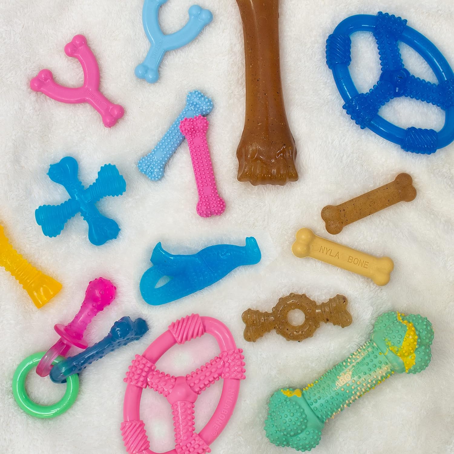 Pet Supplies : Nylabone Spin Tug & Play Pink Puppy Chew Toy for Teething - Puppy Supplies - Peanut Butter Flavor, Medium/Wolf (1 Count) : Amazon.com